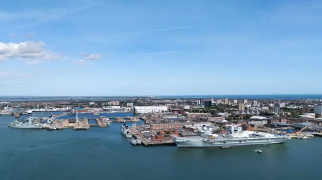An aerial view of The Royal Navy's HMS Queen Elizabeth aircraft carrier and other ships at His Majesty's Naval Base (HMNB) Portsmouth.