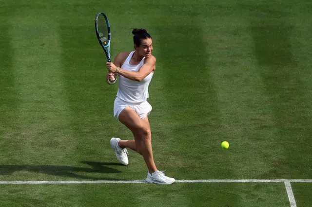 Lois Boisson of France plays a backhand