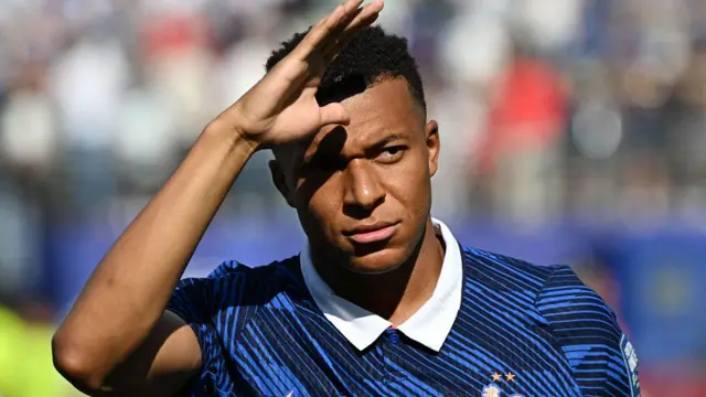 France's forward #10 Kylian Mbappe gestures ahead of the 2026 World Cup round of 32 football match between France and Sweden.