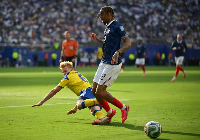 Daniel Svensson and France's forward #12 Bradley Barcola fight for the ball