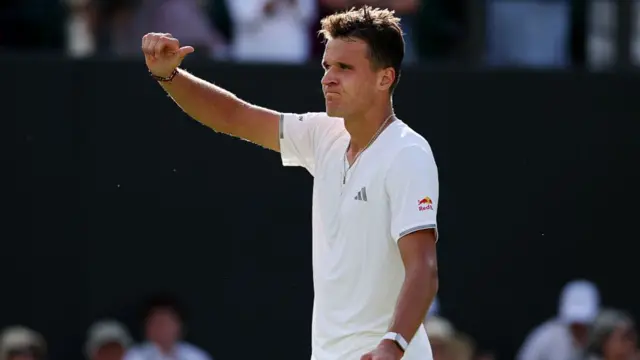 Jakub Mensik gestures to the crowd