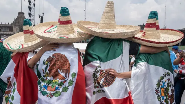 Mexico fans attend a fan event in Mexico City wearing sombreros and flags
