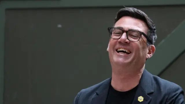 Andy Burnham laughing