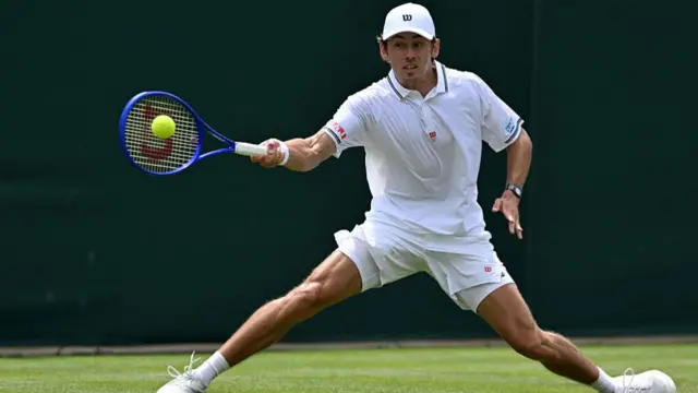 Alex De Minaur returns