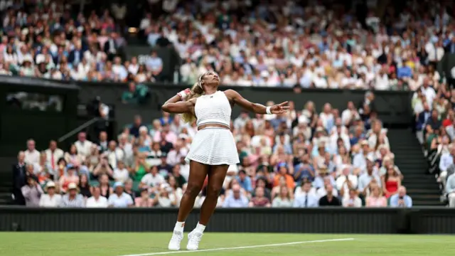 Serena Williams serves