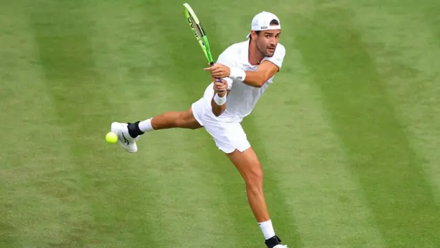 Matteo Berettini hits a backhand