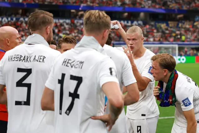 Erling Haaland #9 of Norway speaks with teammates