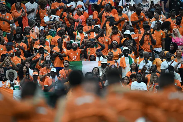 The fans of Ivory Coast sing during national anthem