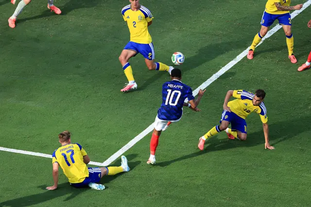 Kylian Mbappe of France scores their first goal