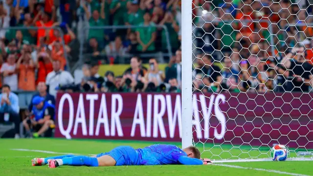 Netherlands goalkeeper Bart Verbruggen lies face down with the ball in his net