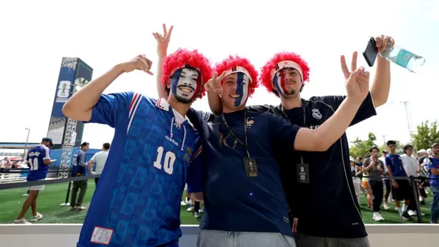 France fans pose for photos as they arrive before the FIFA World Cup 2026