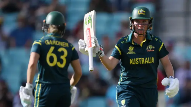 Beth Mooney raises her bat