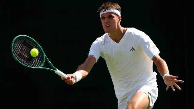 Jakub Mensik plays a forehand