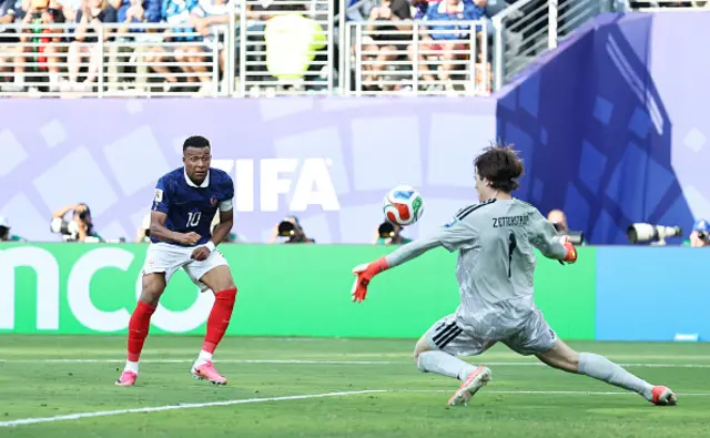 Kylian Mbappe #10 of France scores his team's third goal