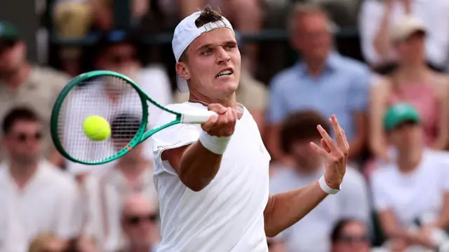 Jakub Mensik plays a forehand