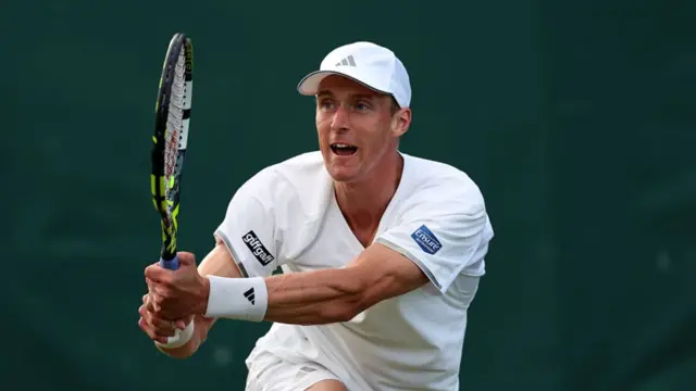Jan Choinski hits a backhand