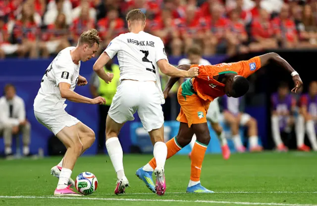 Ange-Yoan Bonny #9 of Cote d'Ivoire competes for the ball