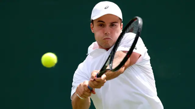 Arthuer Fery hits a backhand