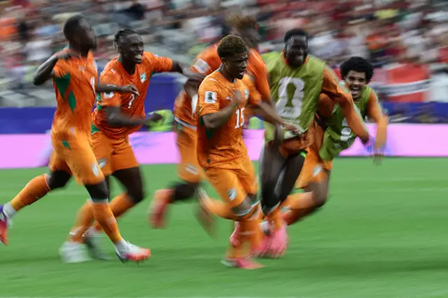 Amad Diallo (C) celebrates with teammates
