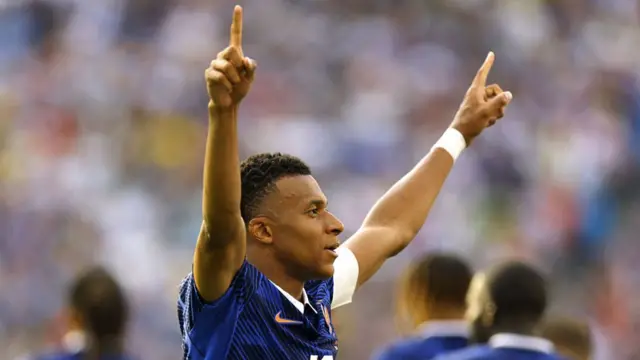 Kylian Mbappe #10 of France celebrates scoring his team's third goal