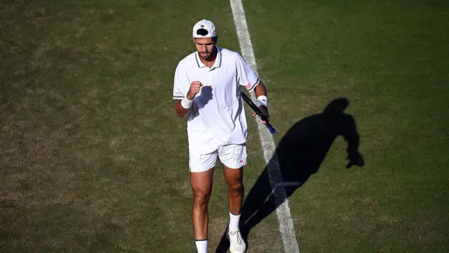 Karen Khachanov celebrates a point