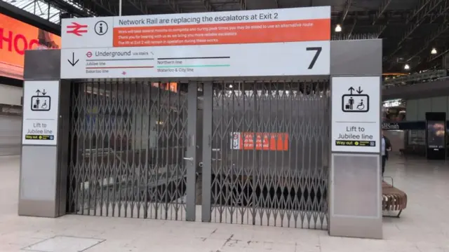 Barrier gates to the Tube platforms are closed at Waterloo Station.