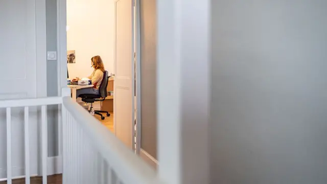 Woman working from home in an office
