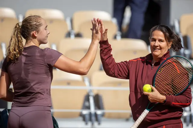 Mirra Andreeva with coach Conchita Martínez during practice on Court Philippe Chatrier