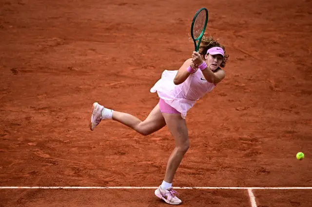 Mirra Andreeva plays a backhand return