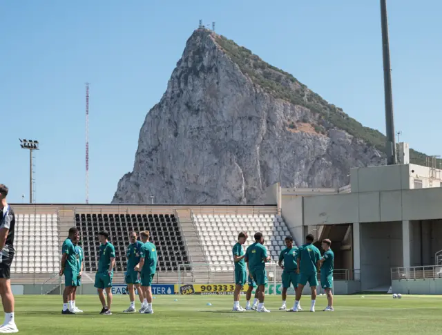 Players with the rock of Gibraltar