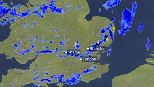 A radar image showing a lot of rain and some lightning over london