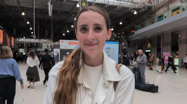 Naoise Standing is pictured on the concourse at Waterloo Station.