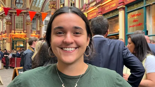 A woman in a green t-shirt