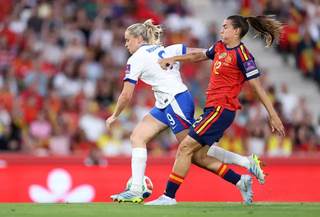 Alessia Russo tries to keep possession