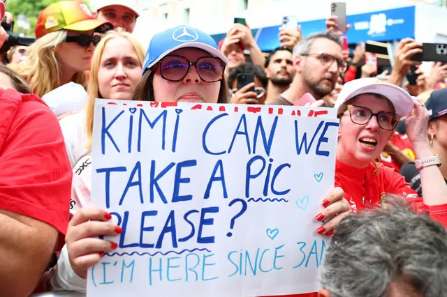 Fans hold up signs for Kimi Antonelli in Monaco