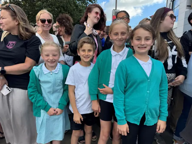 School children with smiles on faces