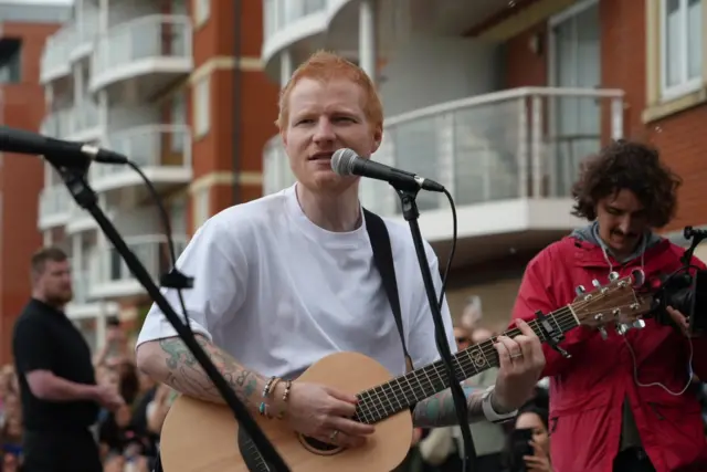 Ed playing his guitar