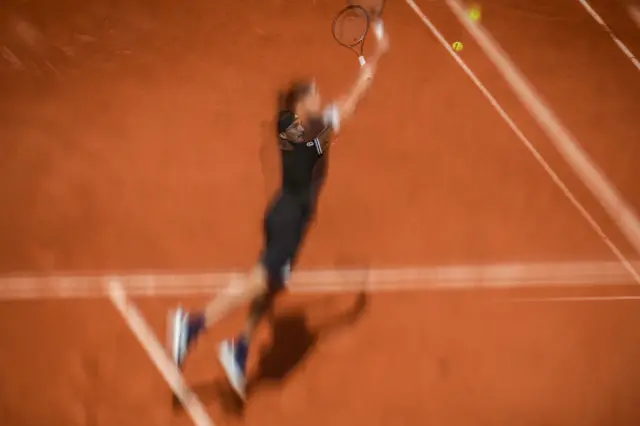 Alexander Zverev stretches to play a backhand