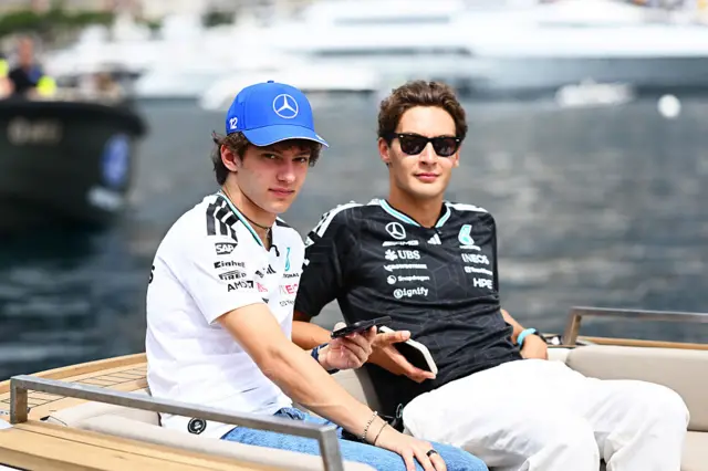 Kimi Antonelli ans Georgw Russell arrive in the paddock via boat