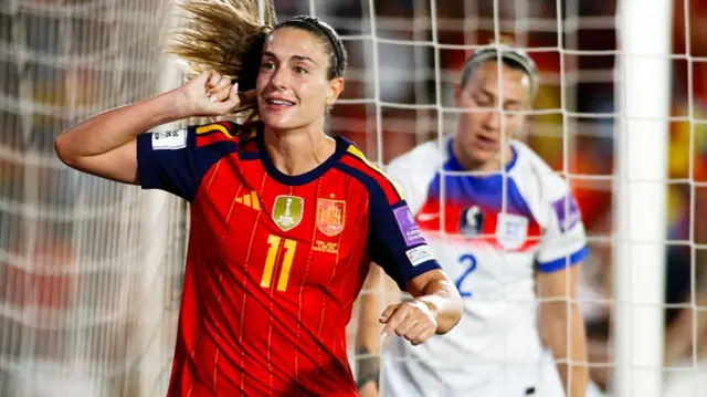 Alexia Putellas celebrates with Lucy Bronze in the background