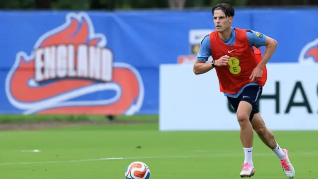 Alex Scott of England runs with the ball during a training session