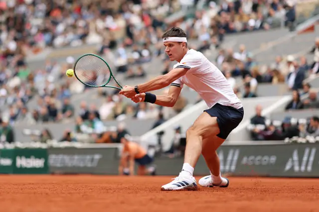 Jakub Mensik of Czechia plays a backhand