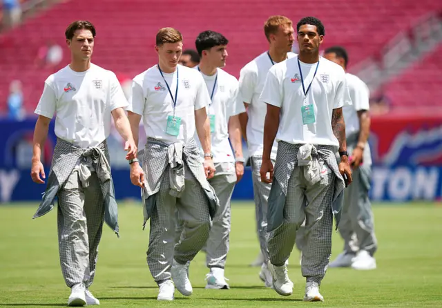 Alex Scott, Elliot Anderson and Jarell Quansah #26 of England inspect the pitch prior to the international friendly match between England and New Zealand at Raymond James Stadium