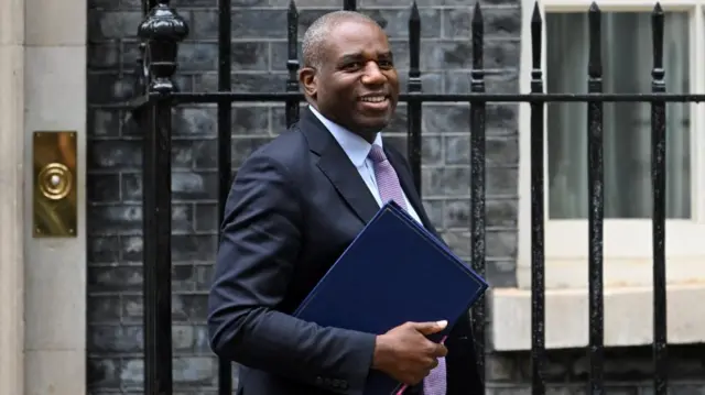 British Deputy Prime Minister and Justice Secretary David Lammy walks outside 10 Downing Street.