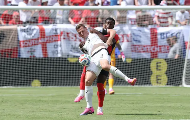 Chris Wood #9 of New Zealand is challenged by Marc Guehi #6 of England during the international friendly match between England and New Zealand