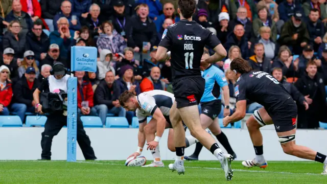 Toby Elliott dots down the ball