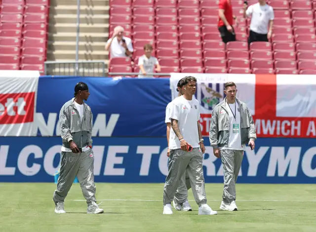 Marcus Rashford, Nico O'Reilly and Dean Henderson #13 of England inspect the pitch prior to the international friendly match between England and New Zealand at Raymond James Stadium