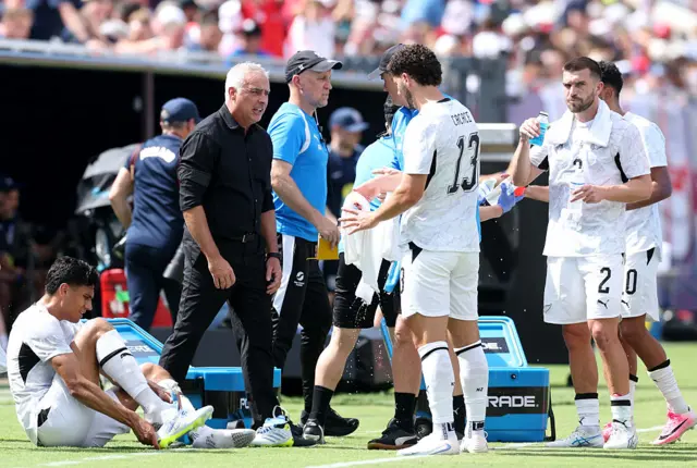 Darren Bazeley, Head Coach of New Zealand, speaks to his team in a drinks break during the international friendly match between England and New Zealand