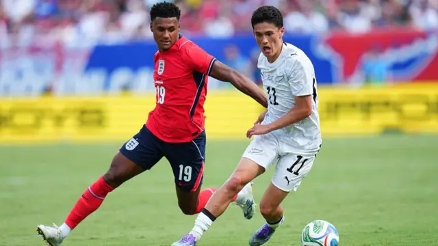 Elijah Just #11 of New Zealand is challenged by Ollie Watkins #19 of England during the international friendly match between England and New Zealand