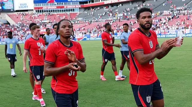Rio Ngumoha and Reece James #24 of England applaud the fans at the end of the international friendly match between England and New Zealand